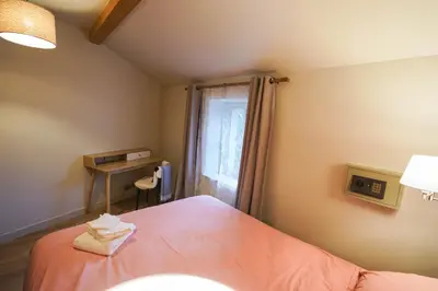 Un ou plusieurs lits dans un hébergement de l'établissement Le Petit Paradis de Pruzilly
