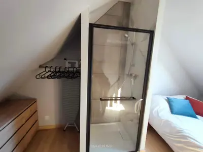 Un ou plusieurs lits dans un hébergement de l'établissement Maisonnette avec jardin