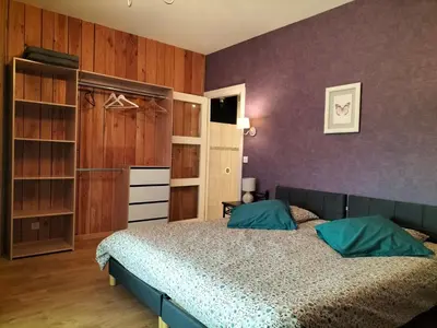 Un ou plusieurs lits dans un hébergement de l'établissement Les Chambres d'Anna