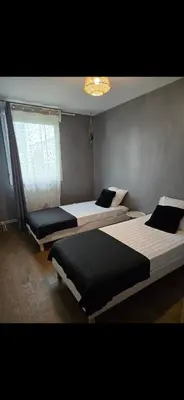 Un ou plusieurs lits dans un hébergement de l'établissement Maison Villa