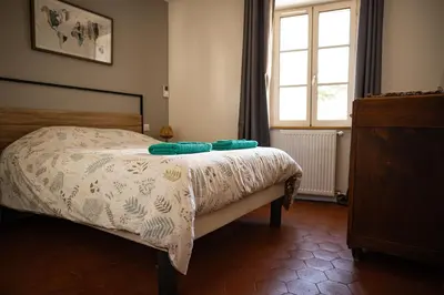 Un ou plusieurs lits dans un hébergement de l'établissement Gîte des Cadoles