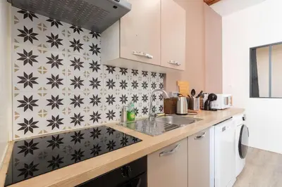 Cuisine ou kitchenette dans l'établissement L'immeuble Carnot