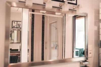 Salle de bains dans l'établissement Le Cosy