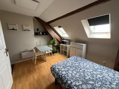 Un ou plusieurs lits dans un hébergement de l'établissement Studio rénové gare Dijon