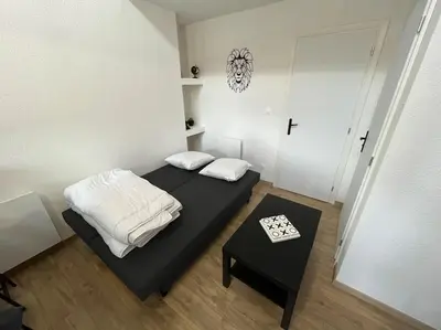 Un ou plusieurs lits dans un hébergement de l'établissement Appartement avec du cachet