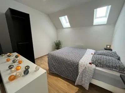 Un ou plusieurs lits dans un hébergement de l'établissement Appartement avec du cachet