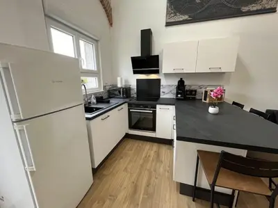 Cuisine ou kitchenette dans l'établissement Appartement avec du cachet