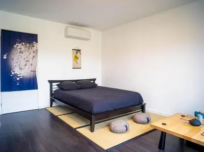 Un ou plusieurs lits dans un hébergement de l'établissement Kitsuné Lodge zen d'inspiration japonaise