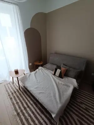 Un ou plusieurs lits dans un hébergement de l'établissement MABULLE, Originalité et Confort au cœur de Dijon