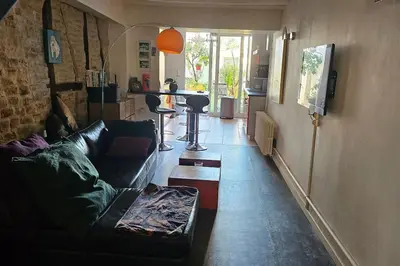 Télévision ou salle de divertissement dans l'établissement Maison de ville