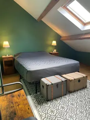 Un ou plusieurs lits dans un hébergement de l'établissement La petite maison du chineur