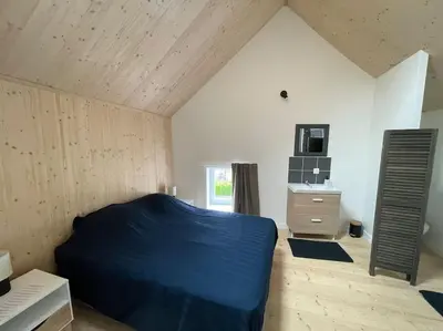Un ou plusieurs lits dans un hébergement de l'établissement Charmante maison de village