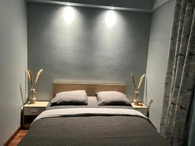 Un ou plusieurs lits dans un hébergement de l'établissement Appartement avec jacuzzi