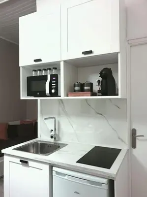 Cuisine ou kitchenette dans l'établissement La petite parenthèse au centre ville
