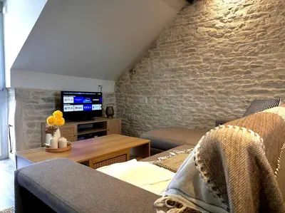 Télévision ou salle de divertissement dans l'établissement Le Mignon de Chenôve
