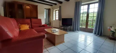 Coin salon dans l'établissement Maison du Lac