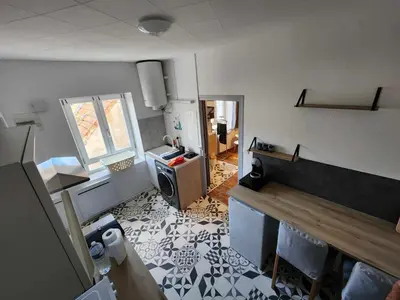 Cuisine ou kitchenette dans l'établissement Le cocon de Julia
