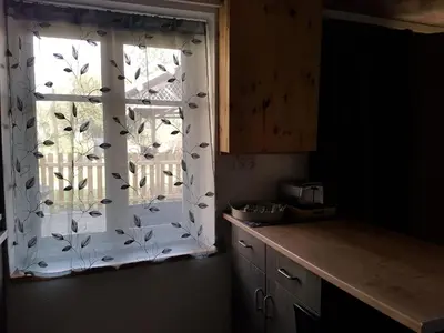 Cuisine ou kitchenette dans l'établissement La Petite Maison du Gardien