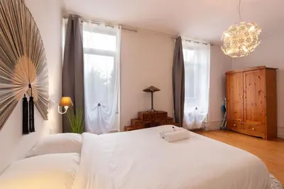 Un ou plusieurs lits dans un hébergement de l'établissement Cabana & Clos des Epinoches