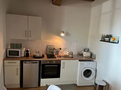 Cuisine ou kitchenette dans l'établissement La Maison aux volets bleus 37 m3, Bords de Saône