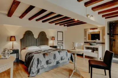 Un ou plusieurs lits dans un hébergement de l'établissement Maison Saunières