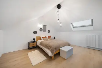 Un ou plusieurs lits dans un hébergement de l'établissement Eros des Vignes Appartement 60m2