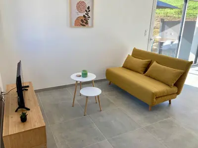 Coin salon dans l'établissement Le gîte de la fontaine - le corbeau