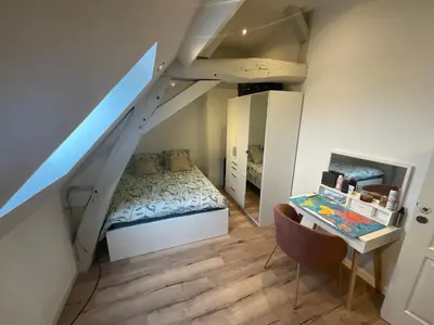 Un ou plusieurs lits dans un hébergement de l'établissement La chambre des petits voyageurs