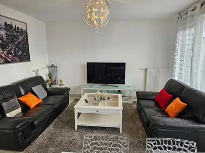 Coin salon dans l'établissement appartement