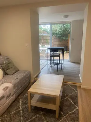 Coin salon dans l'établissement Appartement macon proche gare avec cours