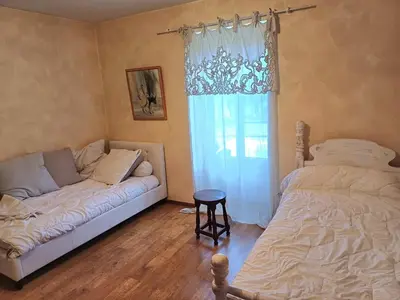 Un ou plusieurs lits dans un hébergement de l'établissement Le Petit Château
