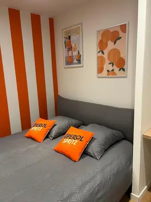 Un ou plusieurs lits dans un hébergement de l'établissement Le Spritz