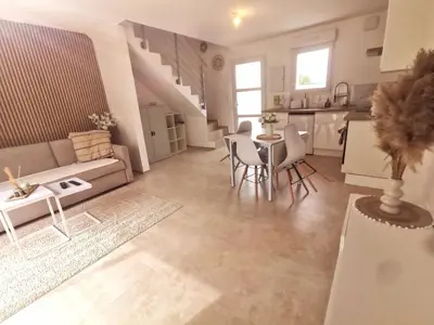 Coin salon dans l'établissement Magnifique duplex neuf parking et terrasse