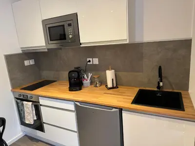 Cuisine ou kitchenette dans l'établissement Logust