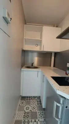 Cuisine ou kitchenette dans l'établissement Studio centre-ville République