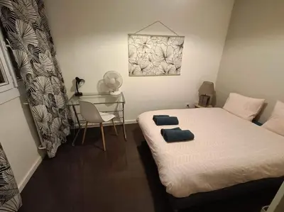 Un ou plusieurs lits dans un hébergement de l'établissement Appartement 3 chambres - Drapeau