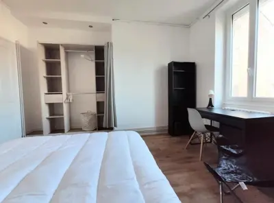 Un ou plusieurs lits dans un hébergement de l'établissement Logement de charme proche centre-ville - TV - WiFi