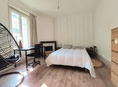 Un ou plusieurs lits dans un hébergement de l'établissement Logement de charme proche centre-ville - TV - WiFi