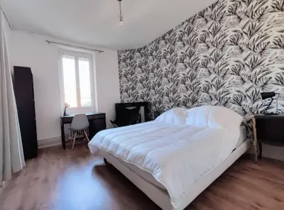 Un ou plusieurs lits dans un hébergement de l'établissement Logement de charme proche centre-ville - TV - WiFi