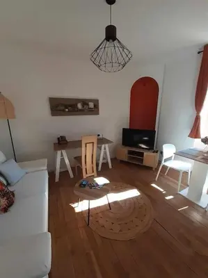 Coin salon dans l'établissement Appartement 2 personnes - fibre