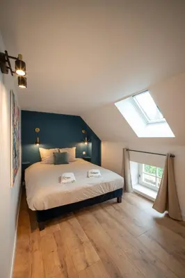 Un ou plusieurs lits dans un hébergement de l'établissement Appartement chaleureux le Grenier de Pommard
