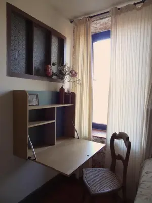 Télévision ou salle de divertissement dans l'établissement Maison p'tite Anne