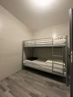 Un ou plusieurs lits dans un hébergement de l'établissement Logement 20 min de Dijon Fenay