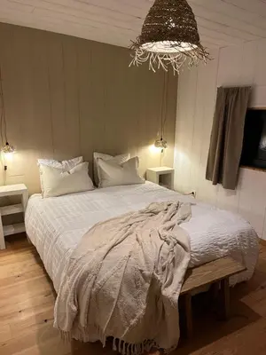 Un ou plusieurs lits dans un hébergement de l'établissement Au Chalet Bourguignon 4