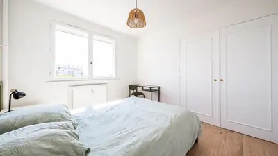 Un ou plusieurs lits dans un hébergement de l'établissement Loft lumineux avec Netflix & parking privé, proche centre Dijon