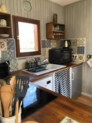 Cuisine ou kitchenette dans l'établissement Chalet Sérénité