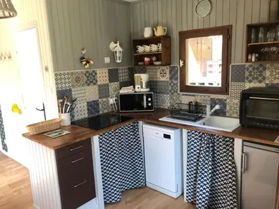 Cuisine ou kitchenette dans l'établissement Chalet Sérénité