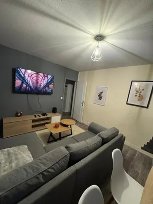 Coin salon dans l'établissement Appartement Cosy