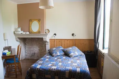 Un ou plusieurs lits dans un hébergement de l'établissement Hotel Camping sur Yonne