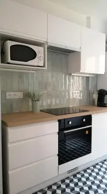 Cuisine ou kitchenette dans l'établissement Appartement calme et raffiné